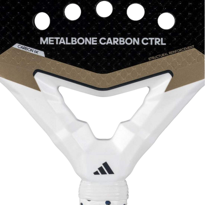 Close-up of a tennis racket with 'Metalbone Carbon Ctrl' branding on a white background