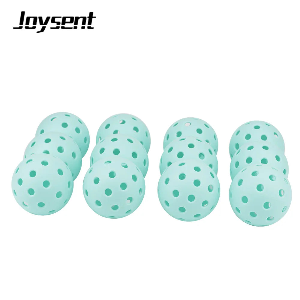 Set of light blue pickleball balls with holes on a white background, featuring the Joysent brand.