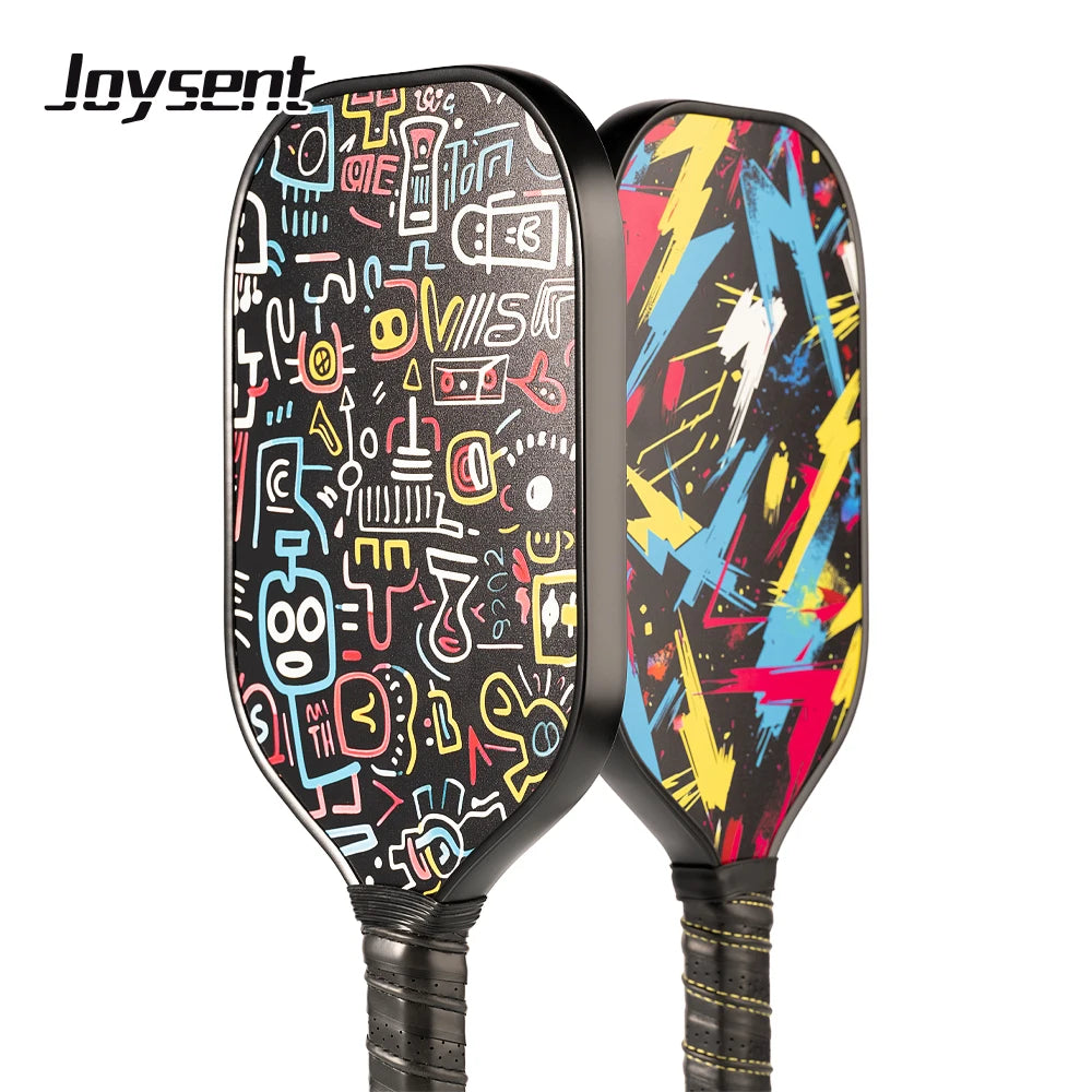 Two colorful pickleball paddles with abstract designs on a white background, featuring the brand 'Joysent'.