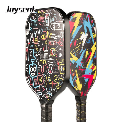 Two colorful pickleball paddles with abstract designs on a white background, featuring the brand 'Joysent'.