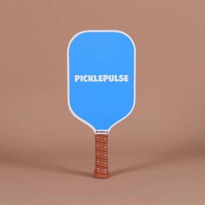 Blue pickleball paddle with 'Picklepulse' branding on a brown background