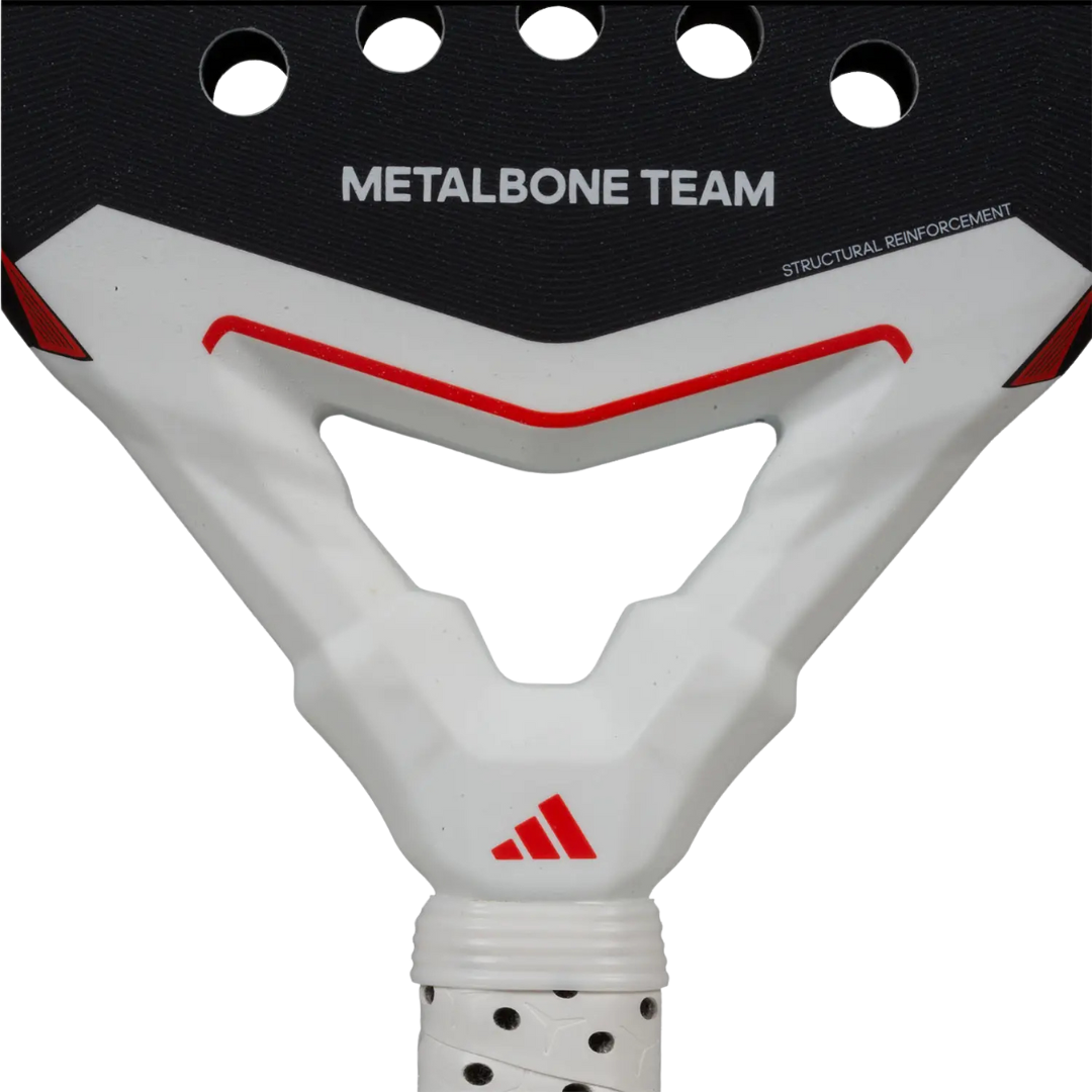 Close-up of a white and black metalbone team skateboard truck with red accents on a white background.