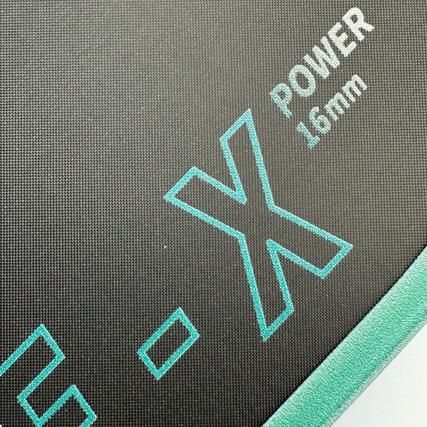 Close-up of a product with 'Power 16mm' and 'X' branding on a gray background.