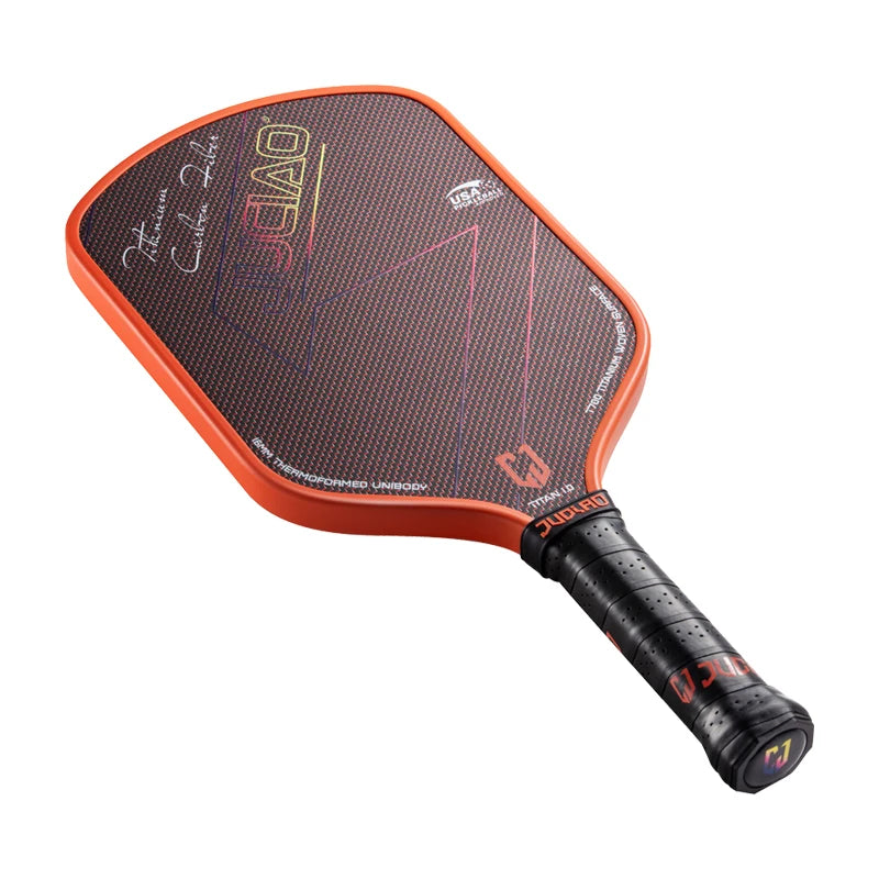 Pickleball paddle with orange rim and black handle on a white background