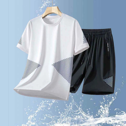 White t-shirt and black shorts with geometric patterns on a blue background