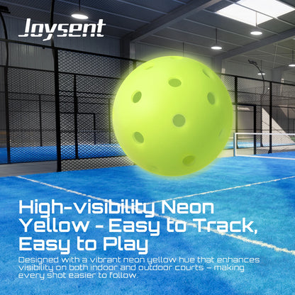 Neon yellow pickleball on an indoor court with Joysent branding and text about high-visibility.