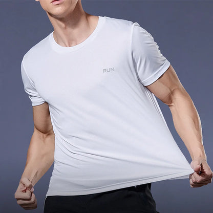 Person wearing a white athletic shirt with 'RUN' text on a dark background