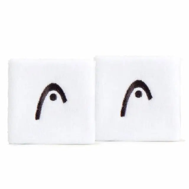 Two white wristbands with black smiley face designs on a white background