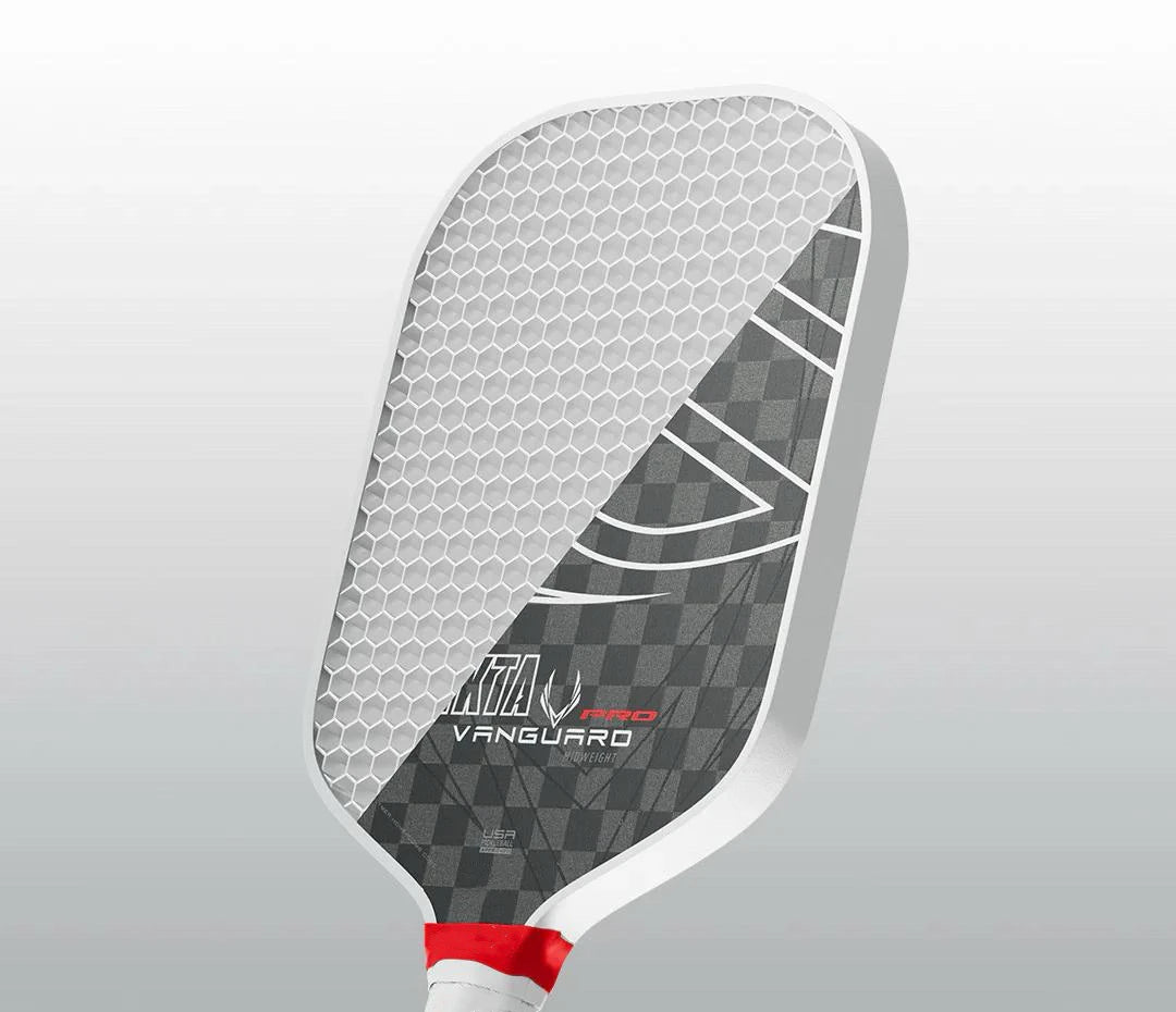 Pickleball paddle with honeycomb design on a gray background