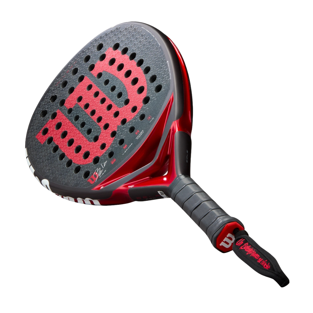 Red and black Wilson tennis racket on a white background