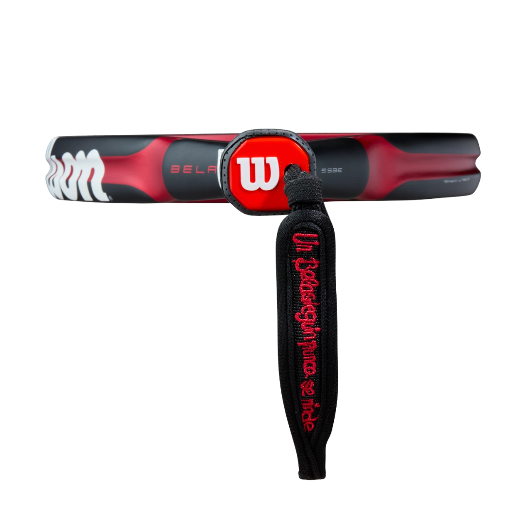 Red and black tennis racket with Wilson branding on a white background