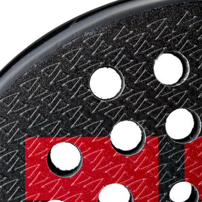 Close-up of a sanding disc with a red and black pattern